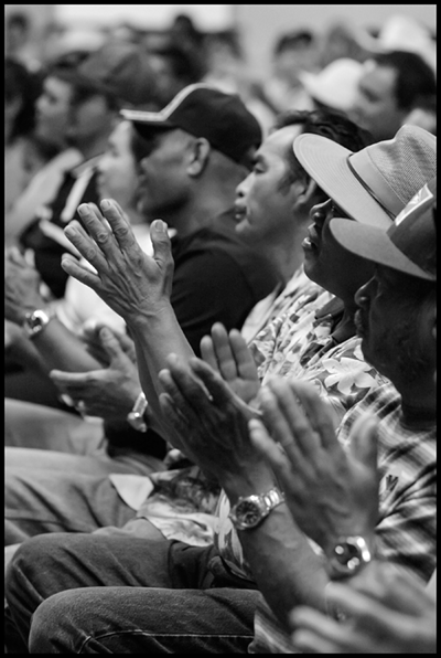 Filipino immigrant workers at an organizing rally at the Forty Acres, the historic home of the United Farm Workers.  Photo by David Bacon